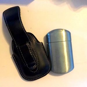 Vintage traveling ash case with clip on holder Unused.